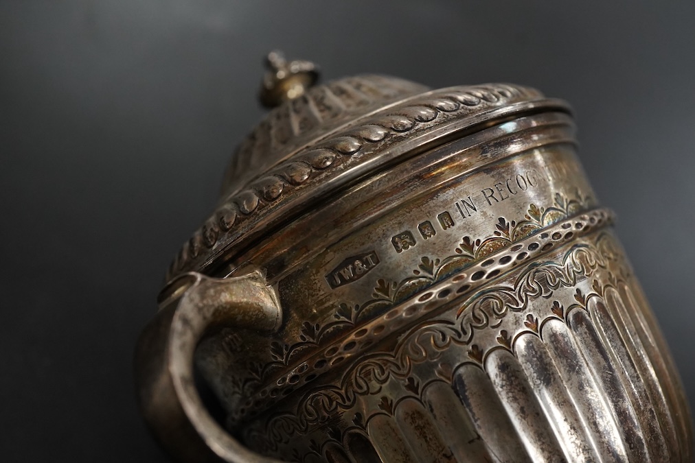 A George V silver twin handled loving cup and cover in early 18th century style height 11cm. , weight approx. 6.56ozt